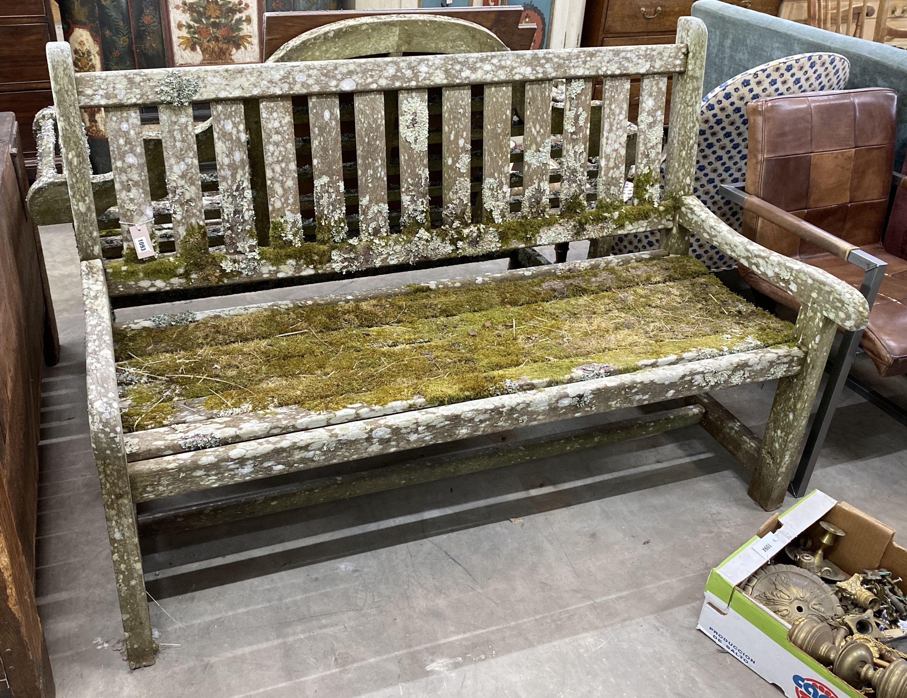 A weathered teak slatted garden bench, length 152cm, depth 66cm, height 104cm